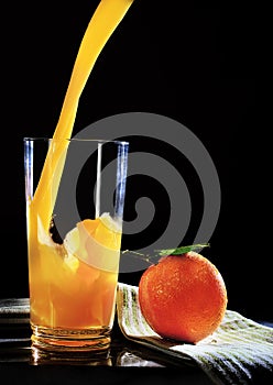 Orange Juice Pouring into Glass