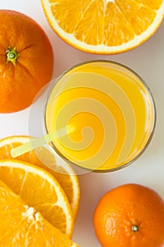 Orange juice with slices and havel of orange