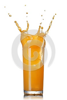 Orange juice splash in the glass isolated on white