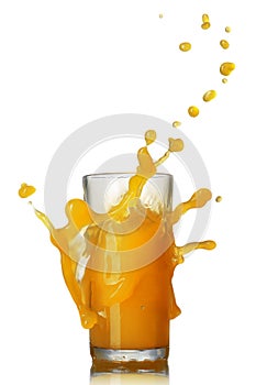 Orange juice splash in the glass on white