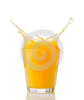 Orange juice splash isolated on white