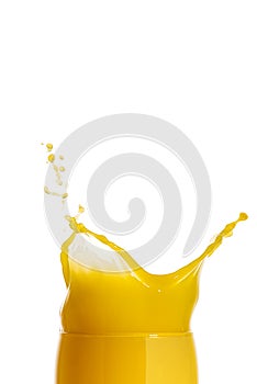 orange juice splash isolated on white. glass of splashing orange juice. close up. stock photo