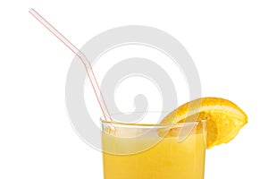 Orange juice with a straw and a slice of orange close-up on a white background
