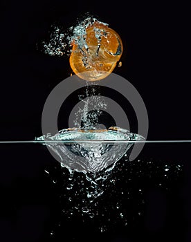 Orange jumping out of the water