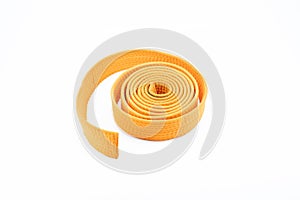 Orange karate belt on white background