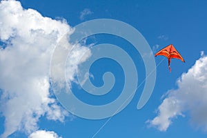 Orange kite in the sky