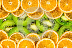 Orange and kiwi slices texture background