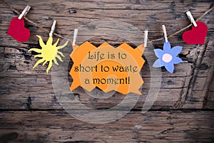 Orange Label With Life Quote Life Is To Short To Waste A Moment