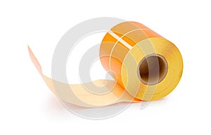 Orange label roll isolated on white background with shadow reflection - clipping path. Color reel of labels for printers. Labels