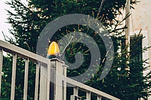 Orange lamp flasher on metal gates