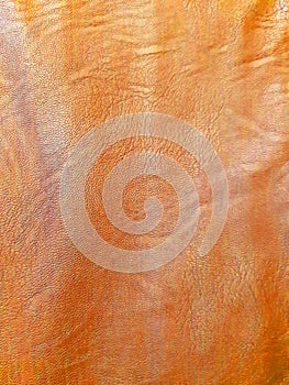 Orange leather surface. Background design, photography. Textile, fabric template, modern new