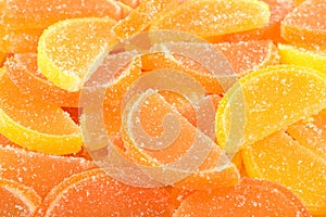 Orange and lemon candy slices close up