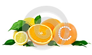 Orange, lemon, grapefruit with vitamin c pills ove