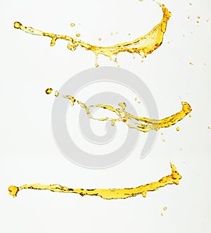 Orange, lemon juice or oil lubricant splash, liquid gold yellow drink drops. Fruit beverage water elements in line form . Fresh