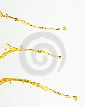 Orange, lemon juice or oil lubricant splash, liquid gold yellow drink drops. Fruit beverage water elements in line form . Fresh