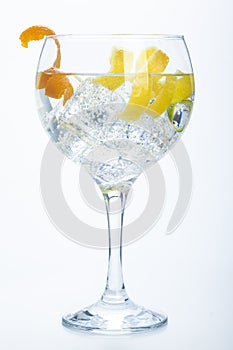 Orange lemon and lime gin tonic isolated over white