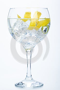 Orange lemon and lime gin tonic isolated over white photo