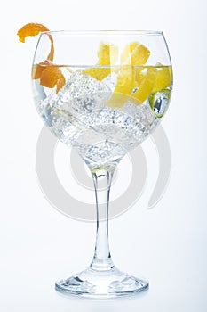 Orange lemon and lime gin tonic isolated over white photo