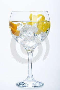 Orange lemon and lime gin tonic over white