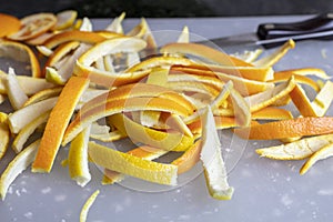 Orange and Lemon Peels being sliced to make Candied Orange and Lemon Peels