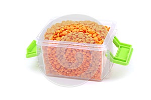 Orange lentils isolated on a white background. Heap of raw red lentil. Vegan food. Healthy food