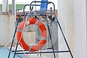 Orange Life Buoy attached to life guard stand