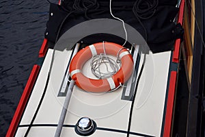 The orange life buoy ring on the boat on the Birmingham old canal