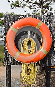 Orange Life Ring and Yellow Rope