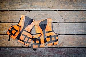 Life vest on wooden ground