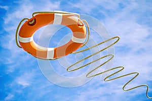 Orange lifebuoy on sky background. Salvation concept. 3d