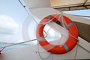 Orange lifebuoy in a speed boat. Travel across the islands in Thailand