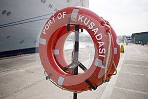 Orange lifebuoy stay in port Kusadasi