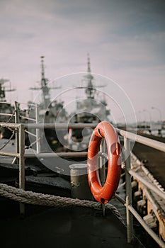 Orange lifebuoys placed on a ship, ue