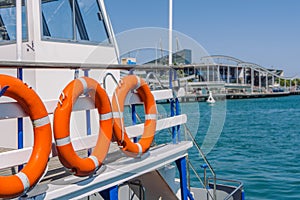 Orange lifebuoys on a pleasure boat