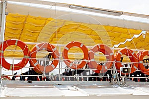 Orange Lifebuoys on ship board