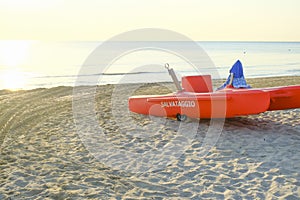Orange lifesaver\'s boat with a name \