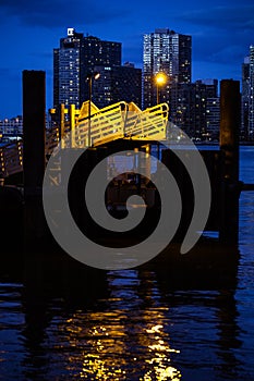 Orange Light on docks on water at night. Sad abstract city night life