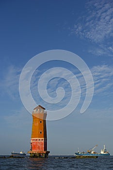 Orange Lighthouse in the middle of the sea of Sunda Kelapa