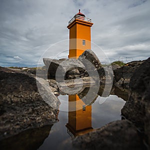 Orange lighthouse at the westcoast of Iceland