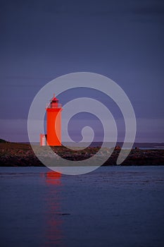Orange lighthouse at the westcoast of Iceland