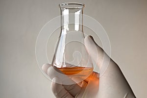 Orange liquid in Erlenmeyer flask