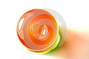 The Orange lollipop on a white background