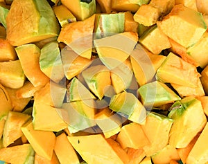 Orange long pumpkin cut into pieces