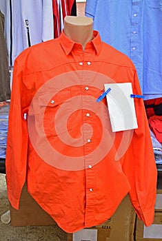 Orange Long Sleeve Work Shirt on Display in Weekend Market