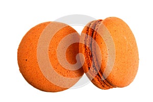 Orange macaroon isolated on white background without a shadow closeup. Top view. Flat lay