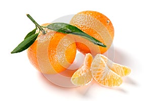 Orange mandarine, tangerine, clementine with leaves isolated on white background