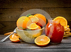 Orange marmlade, orange jam in jar on rustic table