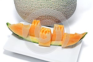 Orange Melon on a white plate.