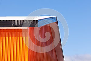 Orange metal sheet siding warehouse construction