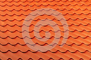 Orange metallic roof tile pattern as background